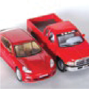 Two small toy vehicles, one a red sports car and the other a red pickup truck, are positioned side by side on a light surface.