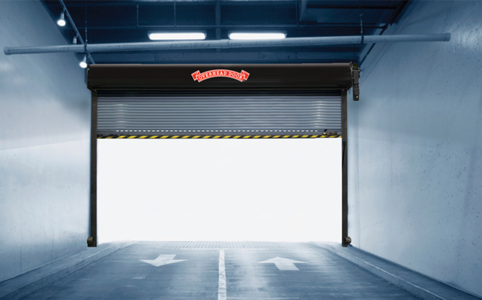 A partially open Model 621 industrial garage door with a Certified Doors logo above lets in bright light. The floor below shows two white arrows pointing outward, indicating exit directions.