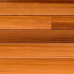 Close-up view of horizontally arranged wooden planks in varying shades of light and medium brown, showing natural grain patterns and a smooth, polished surface.