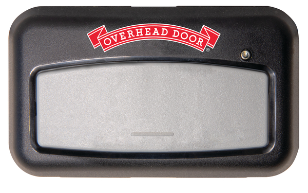 A black and gray Overhead Door 1-button remote garage door opener with a red logo banner and a small LED indicator light in the top right corner.