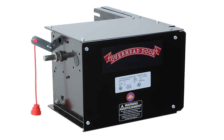 A black Overhead Door CDX Door Operator garage door opener motor unit with a red emergency release cord, metal shaft, and warning labels on the front.