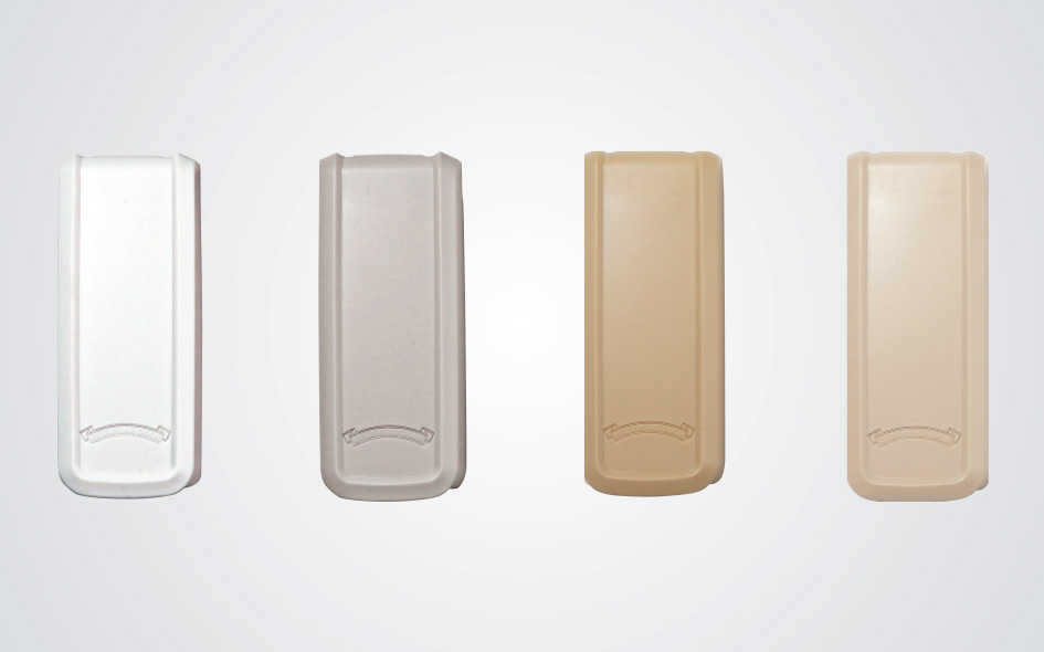 Four rectangular plastic wall-mounted covers are shown in a row, each in a different color: white, light gray, light tan, and beige—ideal for concealing your garage door opener or wireless keypad against any plain light background.