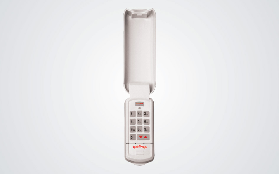 A white wireless keypad for a garage door opener with a flip-up cover open, revealing a numeric keypad and red buttons, set against a plain light background.